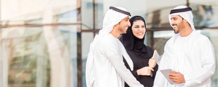 Emirati colleagues shaking hands