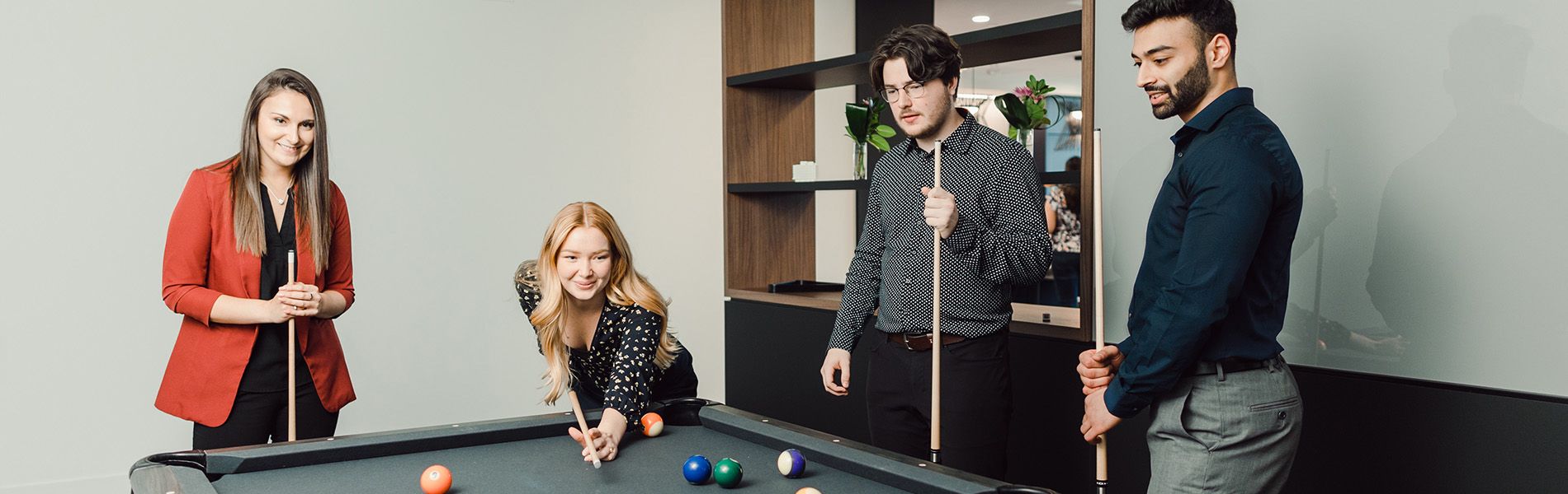 Employees playing pool