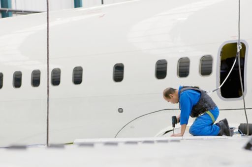 engineer working on jet wing