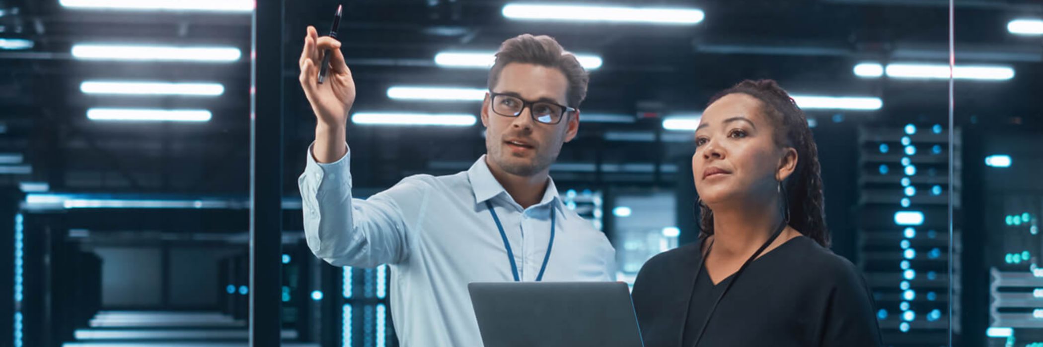 Engineers in server room