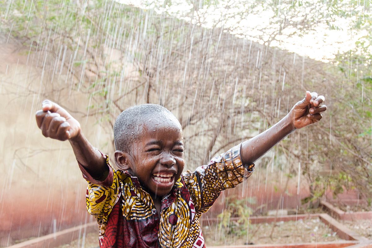 african boy in rain