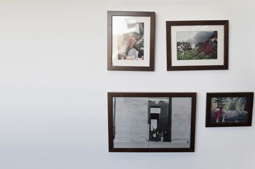 Framed family photos on a wall