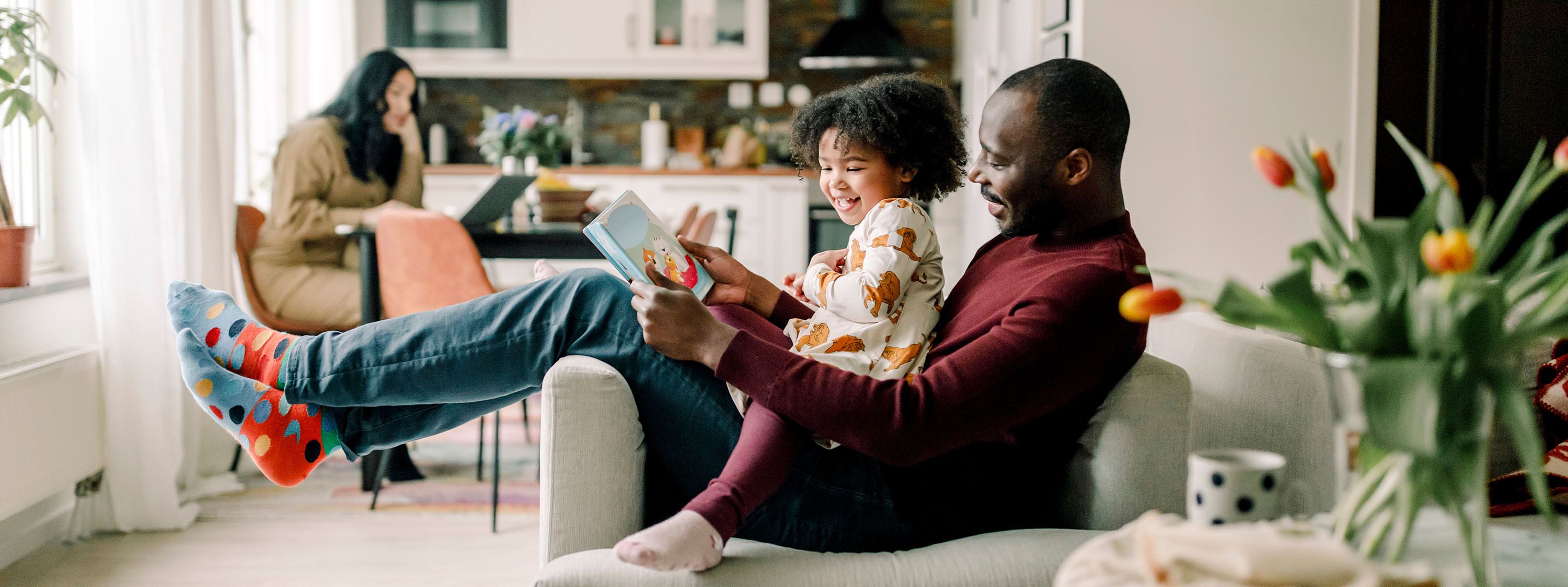 Father and daughter reading book