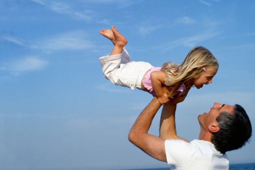 Father playing with girl