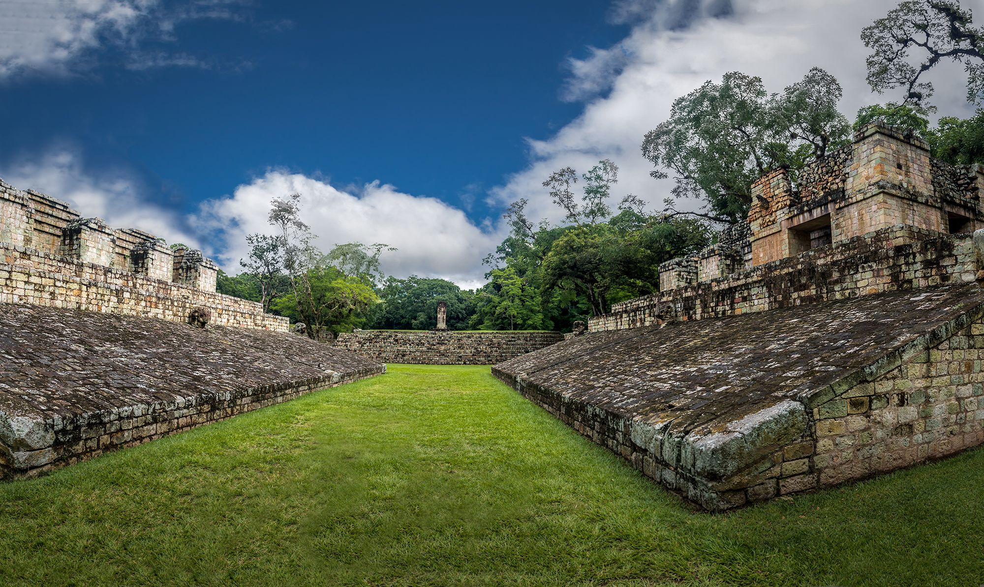 Fort view with green grass and trees against blue sky, Americas Guide Honduras