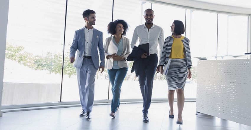 Four Colleagues Walking and Talking