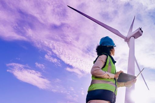 Woman in front of a windmill