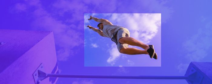 freerunner keeping balance on green ramp