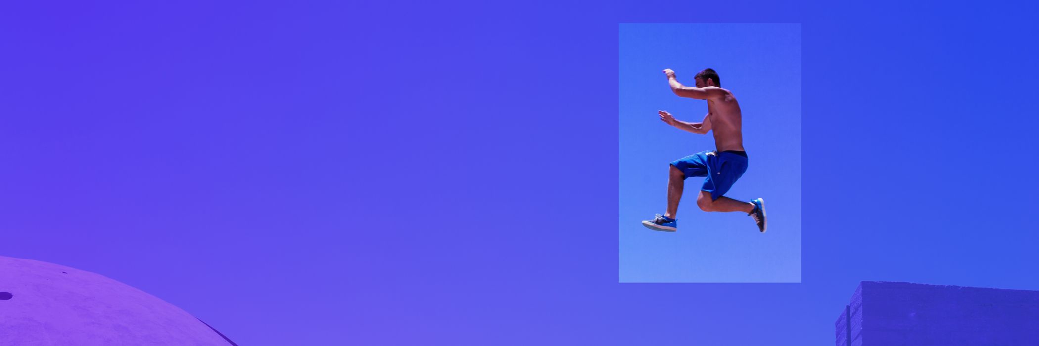 freerunner being in the air in front of sky