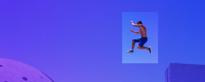 freerunner being in the air in front of sky