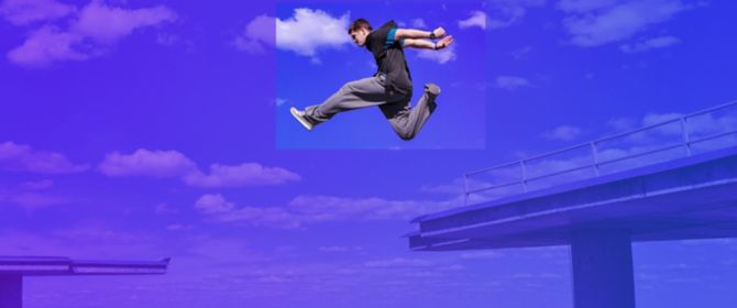 freeruner jumping between concrete in front of city