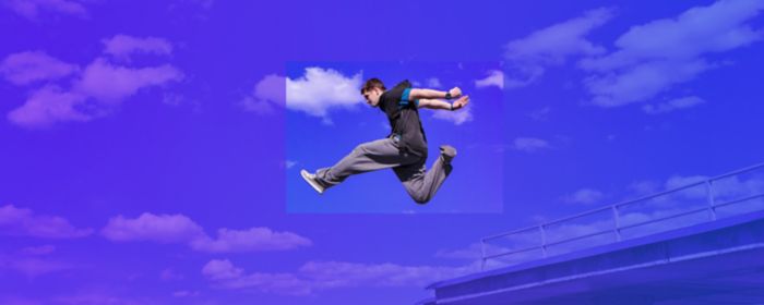 freeruner jumping between concrete in front of city