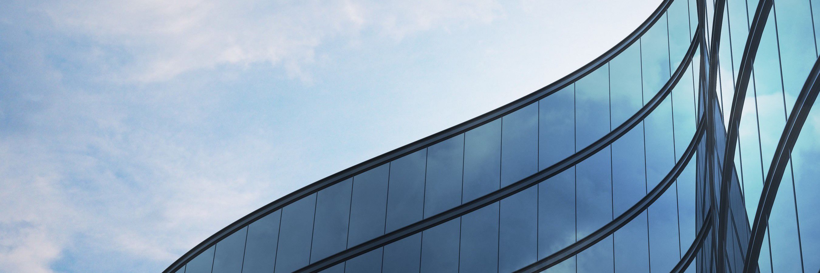 Perspective of high rise building and dark steel window system with clouds reflected on the glass.Business concept of future architecture,lookup to the angle of the building corner. 3d rendering