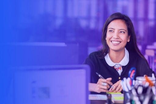 Girl smiling while writing