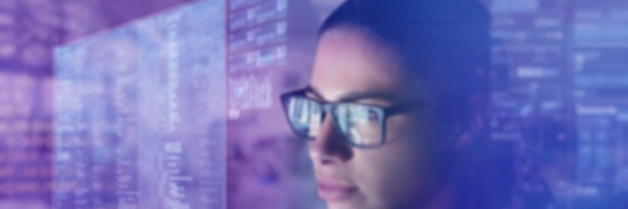 Payments Consulting-girl-wearing-specs-looking-at-smart-screen