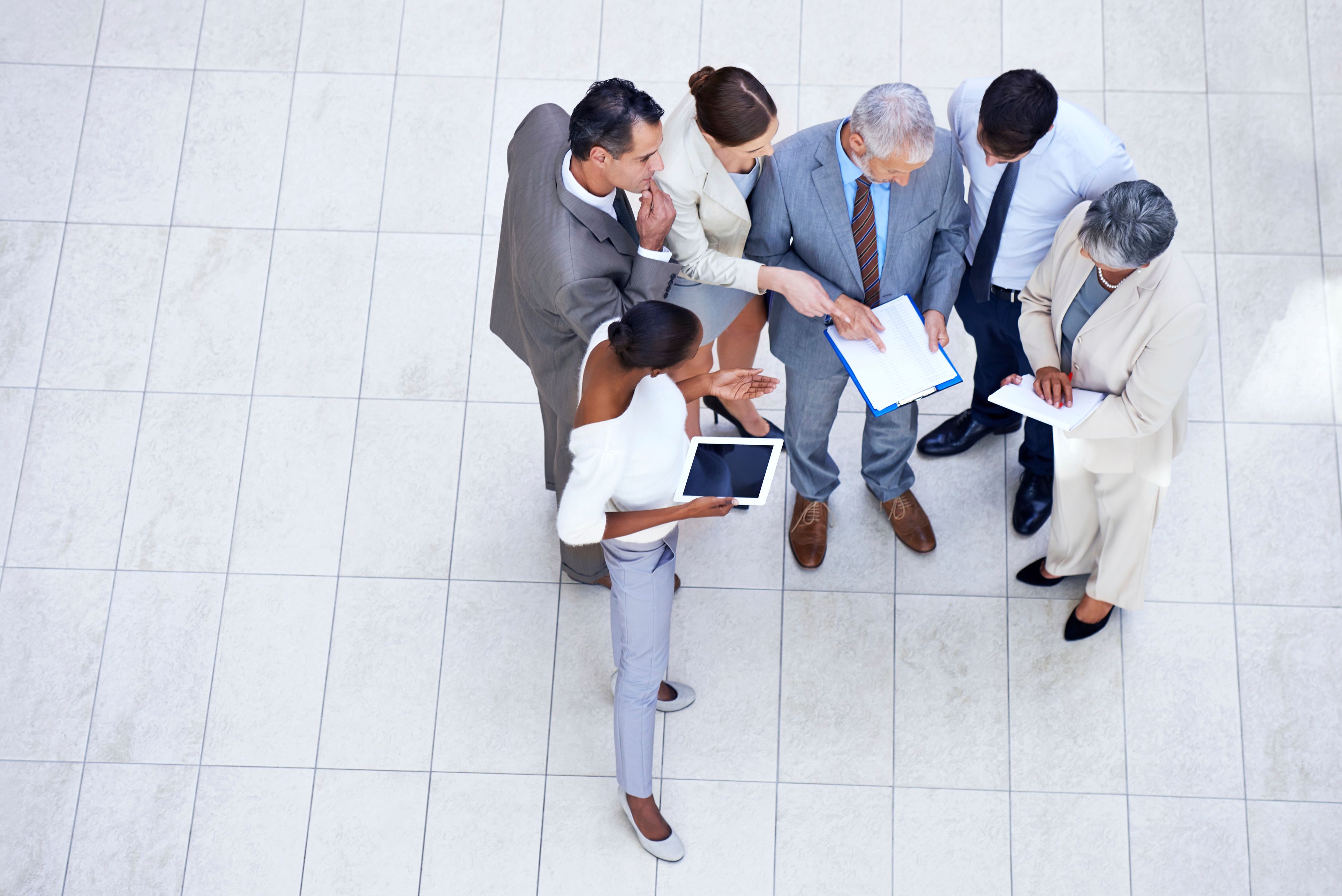 Shot of a group of businesspeople discussing paperwork in a meeting