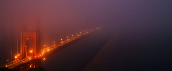 golden gate bridge in fog at night