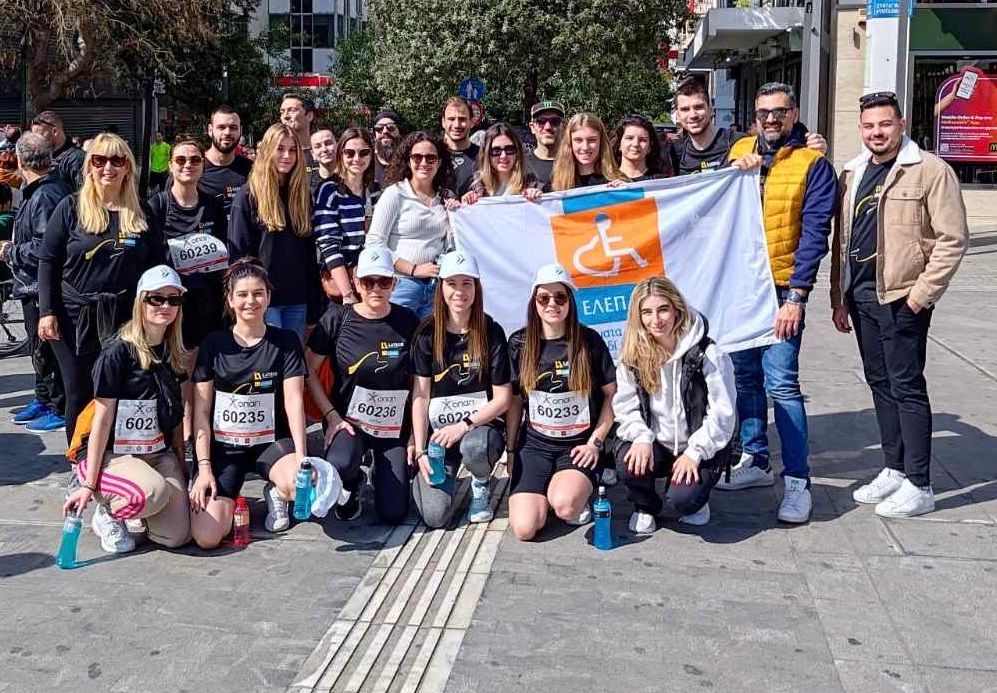 group photo of kpmg employees at the 12th half marathon of athens that ran for the brave children of elepap