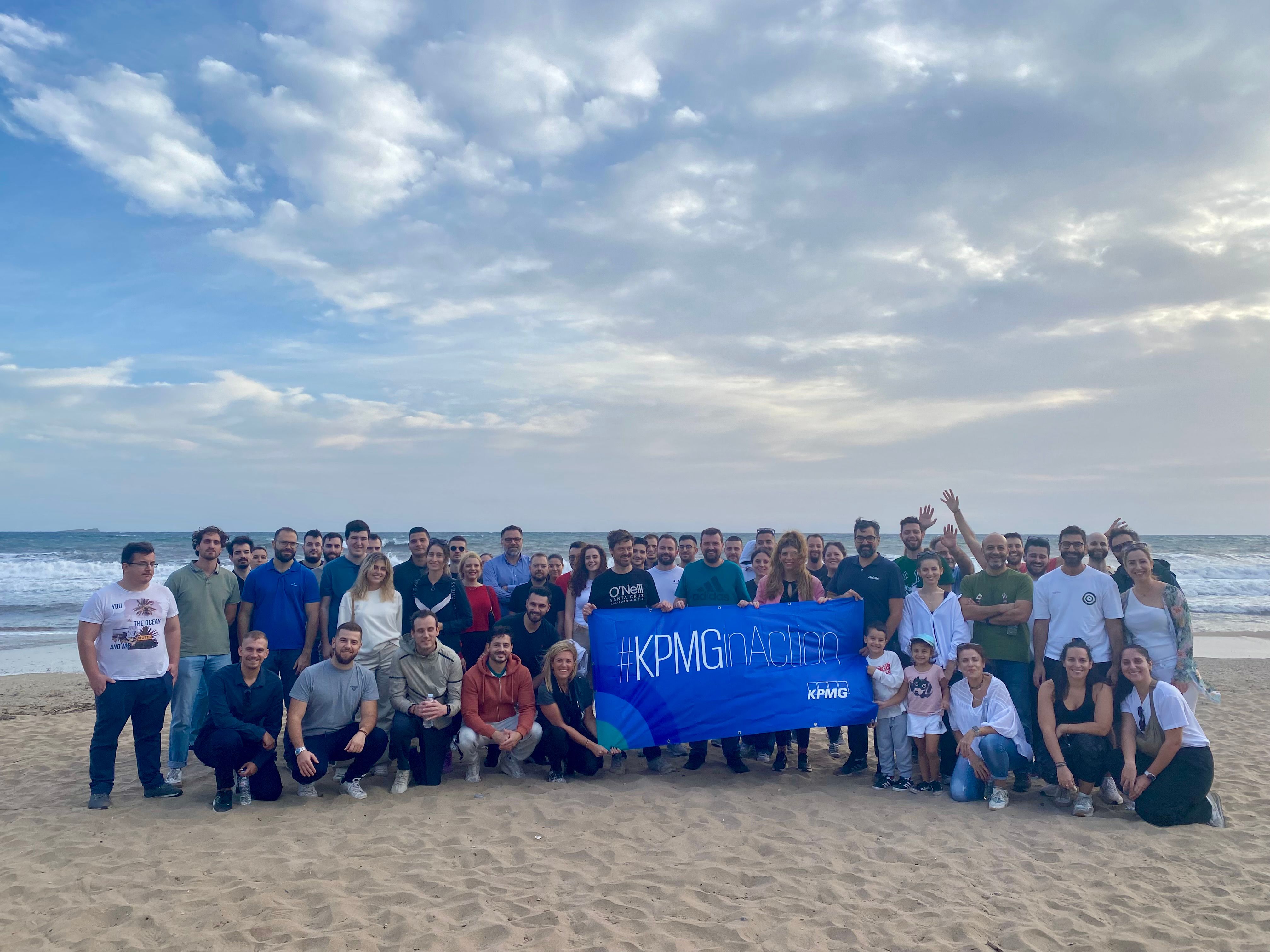 group photograph of kpmg employees at beach cleaning 2023 csr kpmginaction