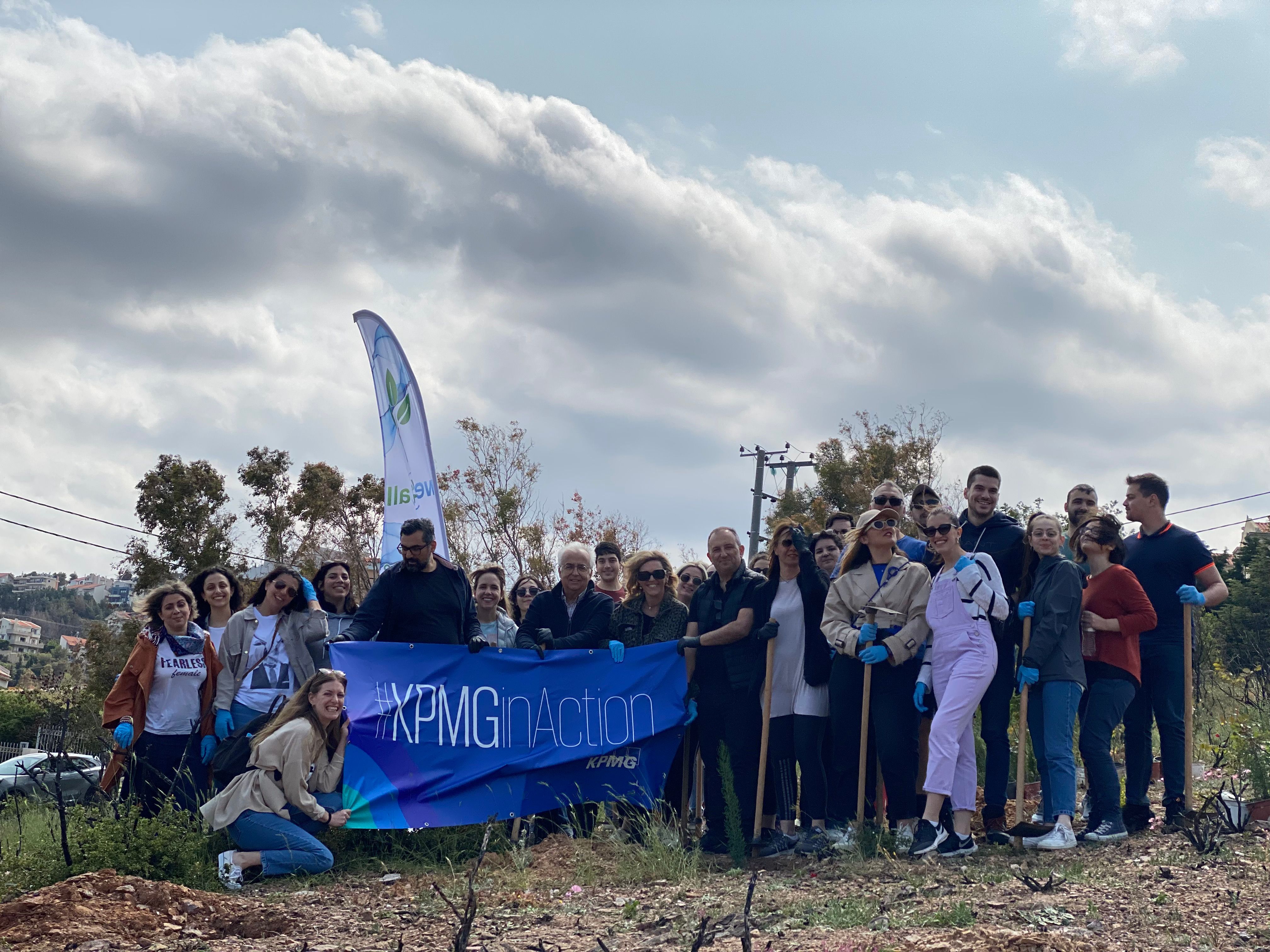 group photo of kpmg employees aftertree planting csr activity