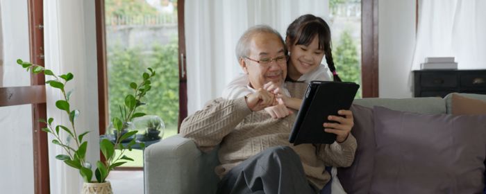person interacting with smartwatch in forest