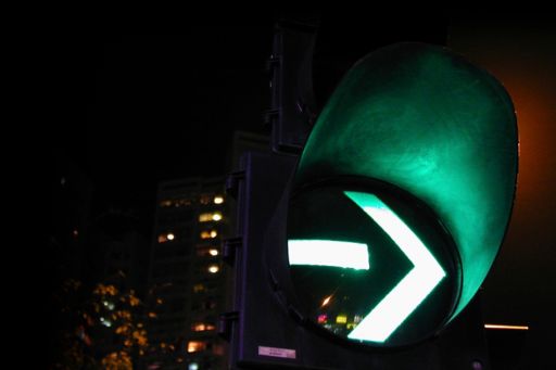 Green traffic signal light at night