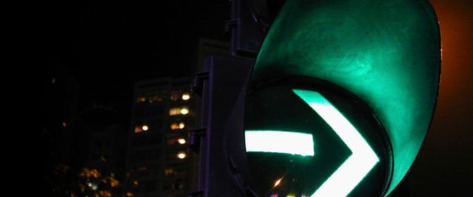 Green traffic signal light at night