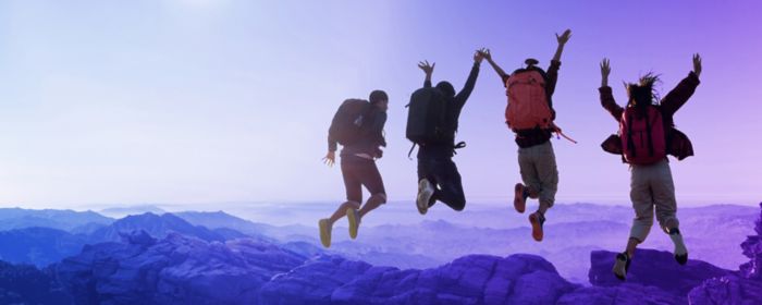 group of hikers jumping