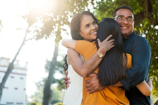 Happy family hugging each-other