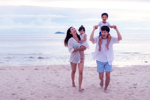 happy family travel on beach