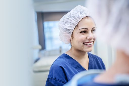 young female surgeon in hospital smiling