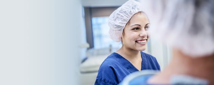 young female surgeon in hospital smiling