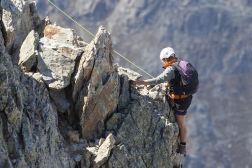 hiker climbing a mountain