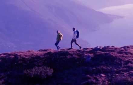 Hikers walking on a mountaintop ridge