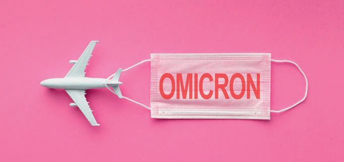 Plane on pink background pulling mask with Omicron on it in red letters