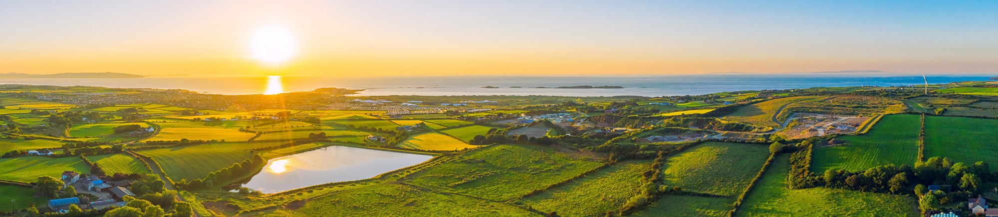 Sunset over green fields