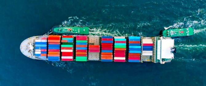 Aerial view of boat carrying shipping containers