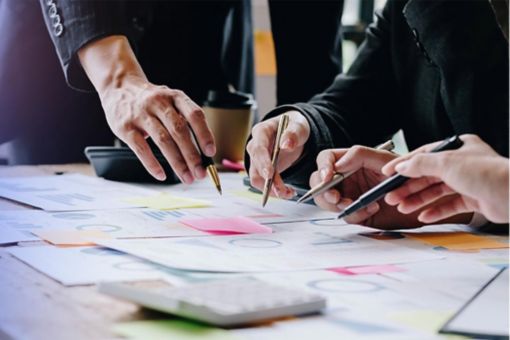 People in meeting looking at documents