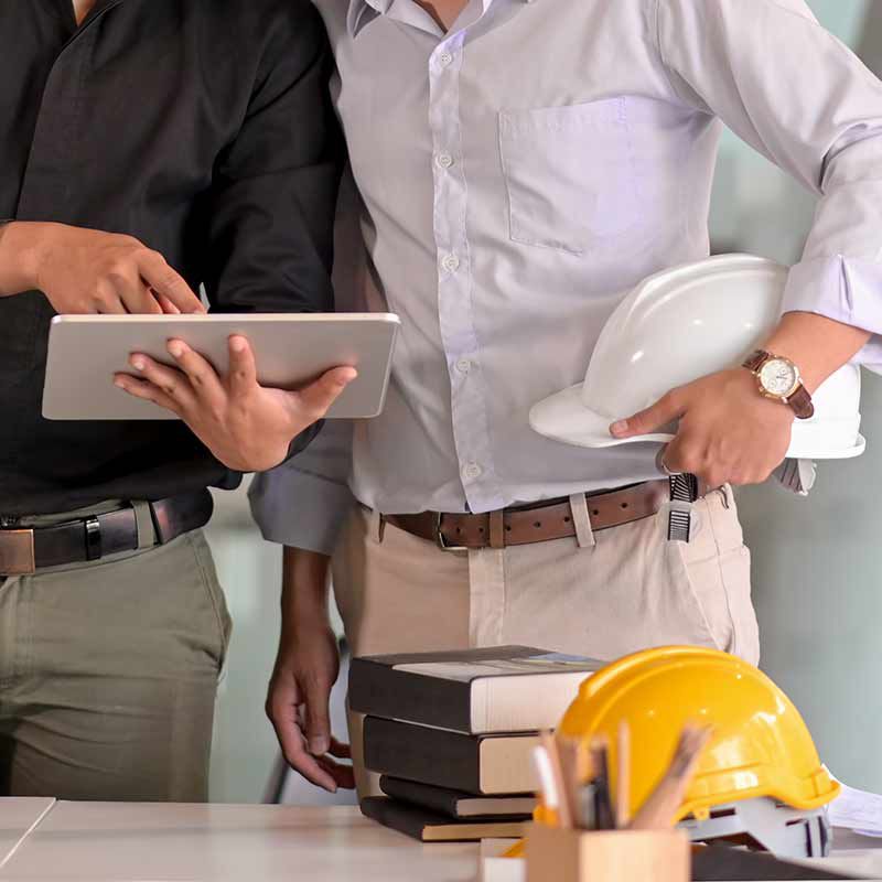 Builders looking at tablet