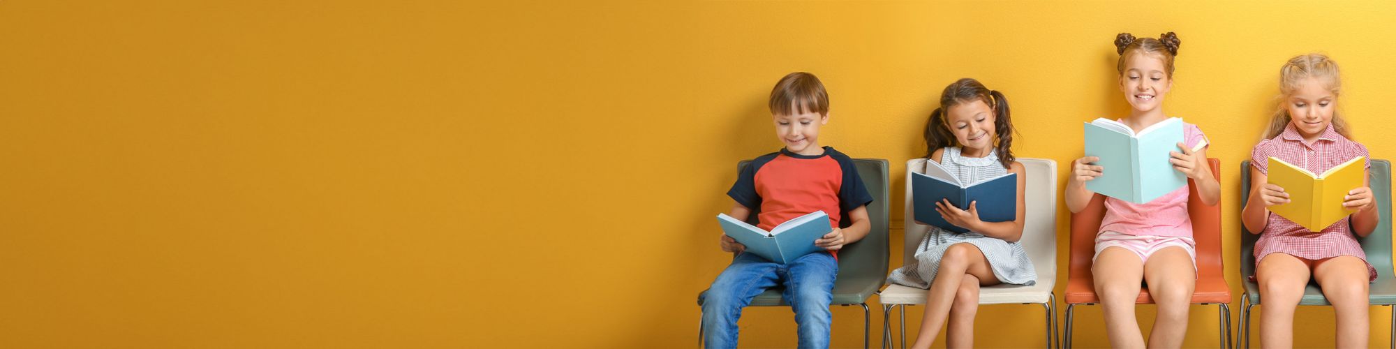 Row of children reading books