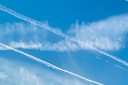 Contrails clouds against blue sky texture background