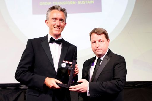 Ciarán Hancock (right), Business Editor at The Irish Times, presents the Deal of the Year award to outgoing Coillte chief executive Fergal Leamy.