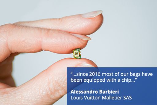Hand holding computer chip with text overlaid "...since 2016 most of our bags have been equipped with a chip… Alessandro Barbieri, Louis Vuitton Malletier SAS"