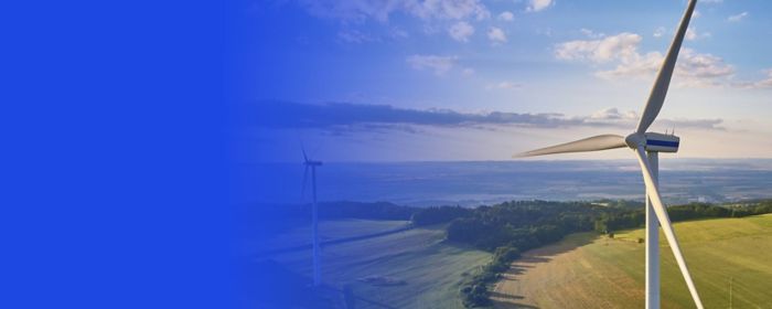 Wind turbines in field