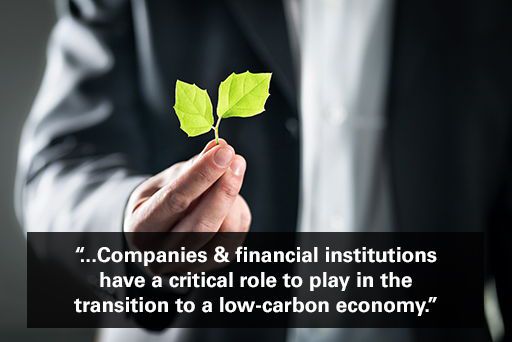 Businessman in suit holding green leaf with text overlaid "companies and financial institutions have a critical role to play in the transition to a low-carbon economy."