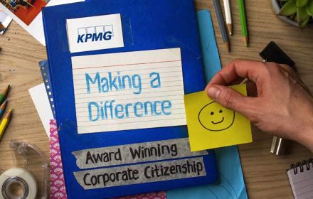 Notebook on craft desk titled KPMG Corporate Citizenship