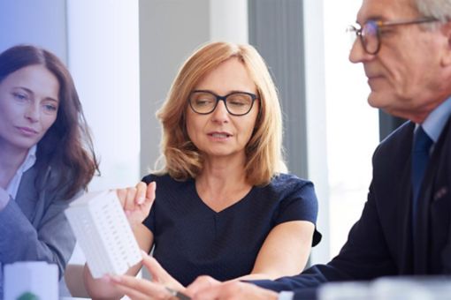 3 people in a meeting