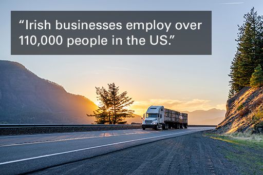 Image of truck on freeway with text overlaid, "Irish businesses employ over 110,000 people in the US."