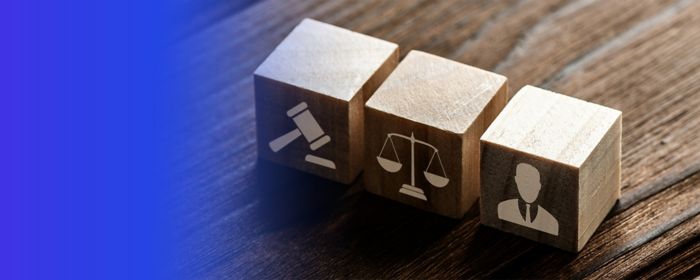 3 wooden blocks with scales, gavel and person icons