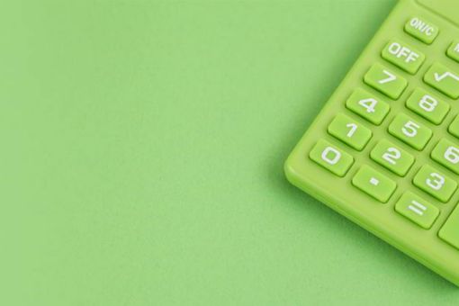 Green calculator on Green background. Copy space. Environmental, Social, Corporate Governance. Green Credit